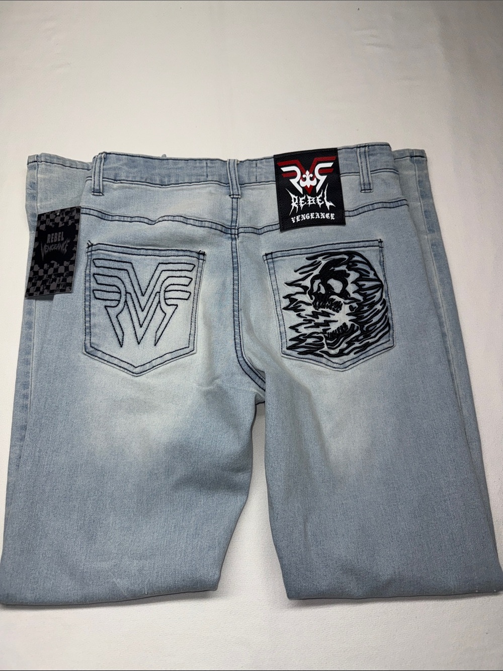 rebels Light Blue Distressed Jeans with Skull Buttons